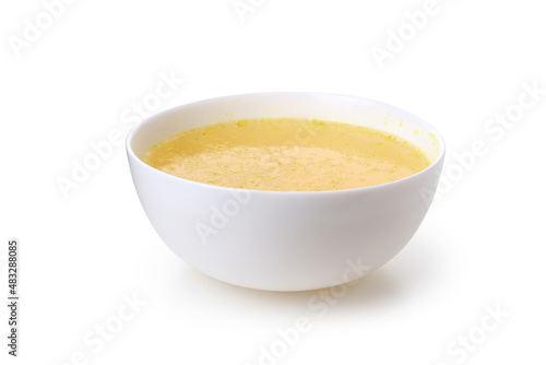 Plate with broth isolated on white background photo