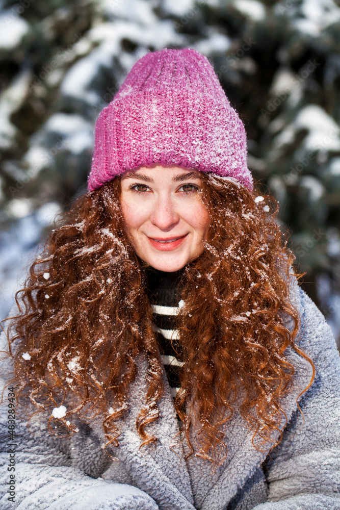 Portrait of a young beautiful woman in a winter park Portrait of a young beautiful woman in a winter park