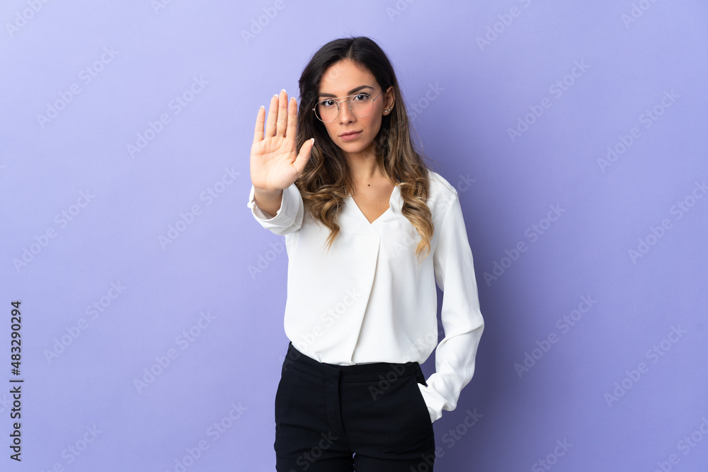 Young caucasian woman isolated on purple background making stop gesture Young caucasian woman isolated on purple background making stop gesture