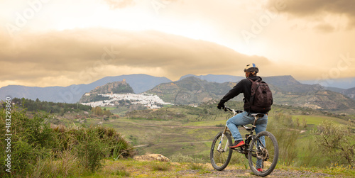 man and bike enjoying landscape view