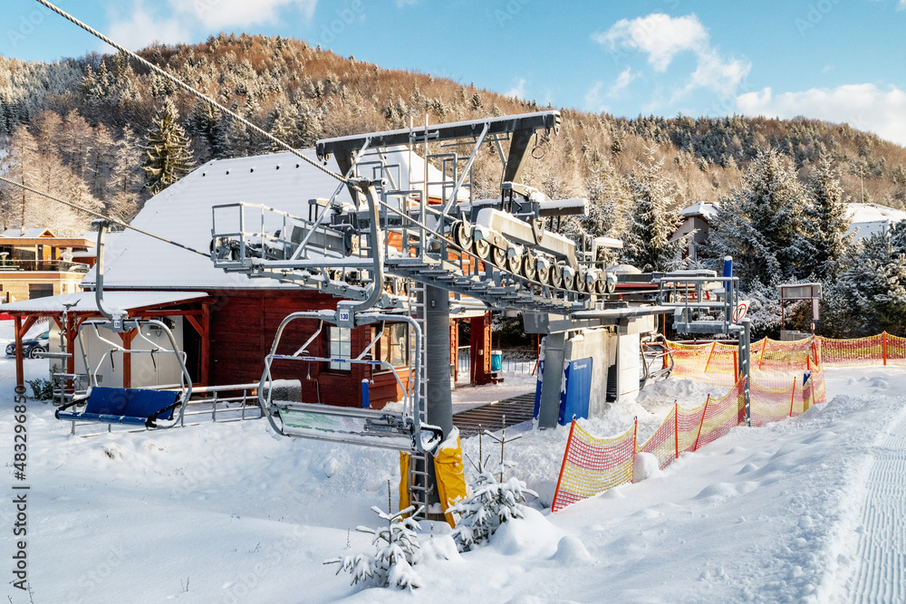 Naklejka premium Bottom station of ski-lift chair at resort Snowland Valca in winter season.