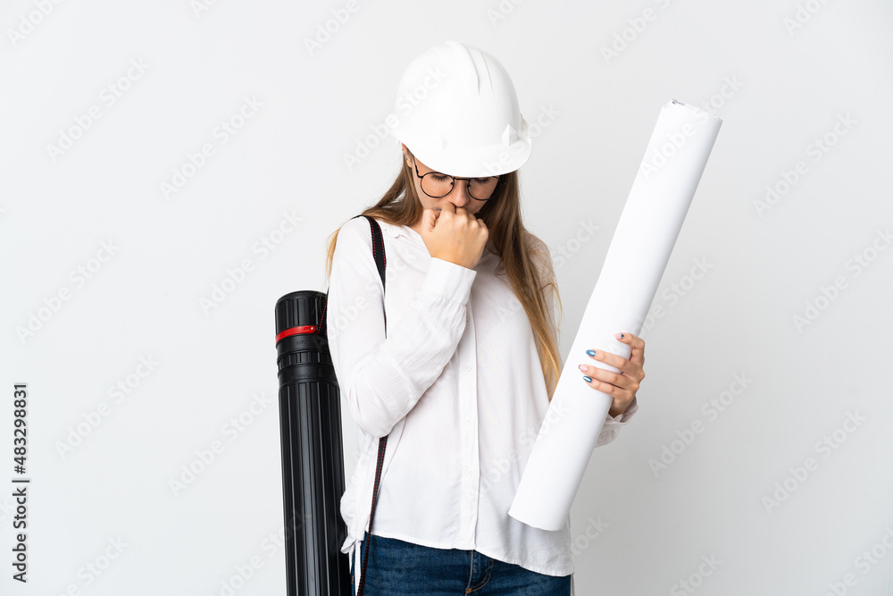Young Lithuanian architect woman with helmet and holding blueprints isolated on white background having doubts Young Lithuanian architect woman with helmet and holding blueprints isolated on white background having doubts