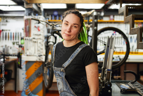 Woman working in bicycle repair shop