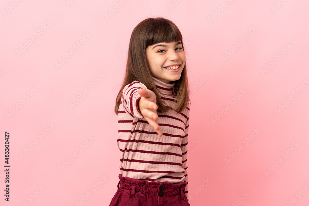 Little girl isolated on pink background shaking hands for closing a good deal Little girl isolated on pink background shaking hands for closing a good deal