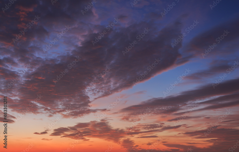 Red and blue sky with clouds at sunrise