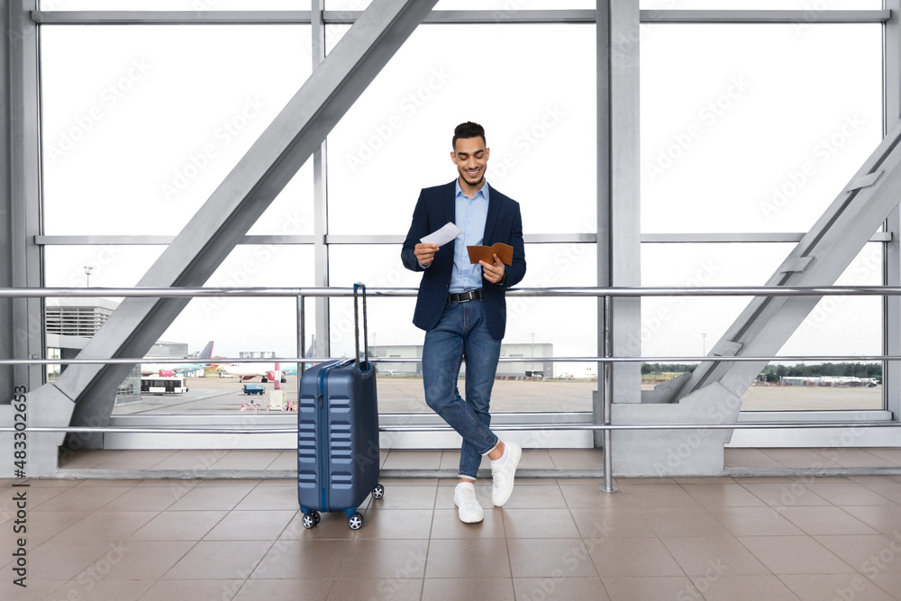 Portrait Of Handsome Middle Eastern Male Traveller Waiting For Flight In Airport Portrait Of Handsome Middle Eastern Male Traveller Waiting For Flight In Airport