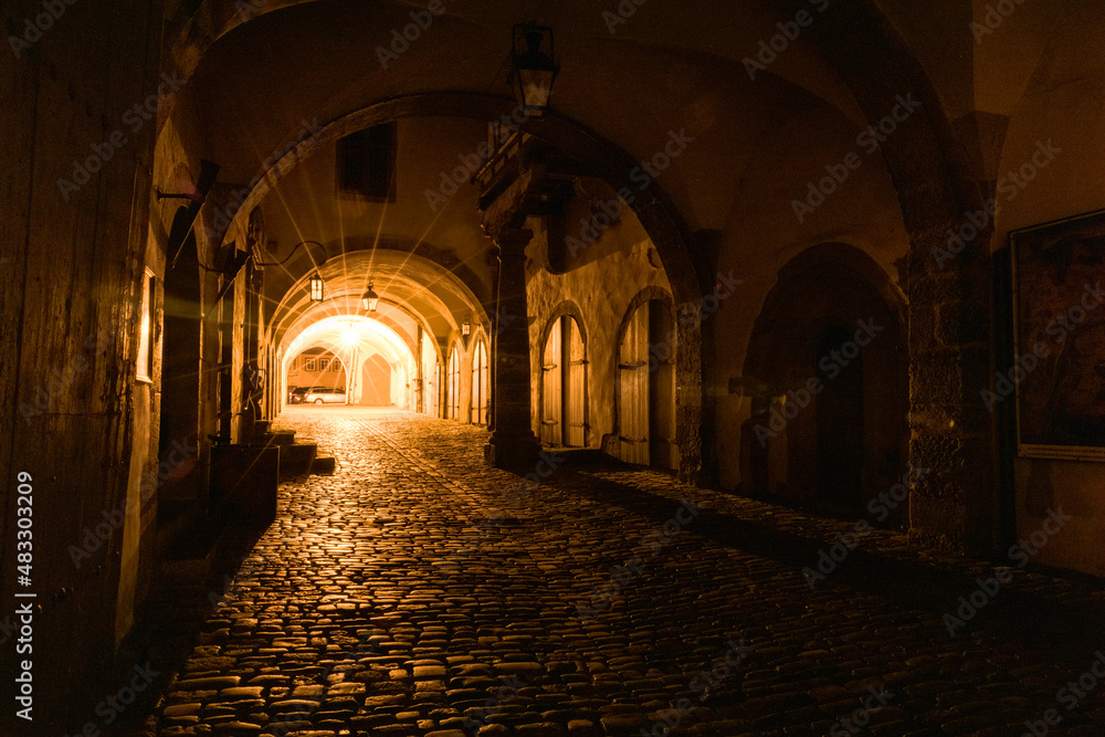Rothenburg ob der Tauber at night long exposure through a dark alley