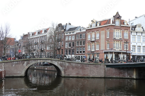 Amsterdam Prinsengracht and Looiersgracht Canal View with Looierssluis Bridge and Traditional House Facades, Netherlands