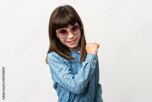 Little girl with sunglasses isolated on white background proud and self-satisfied