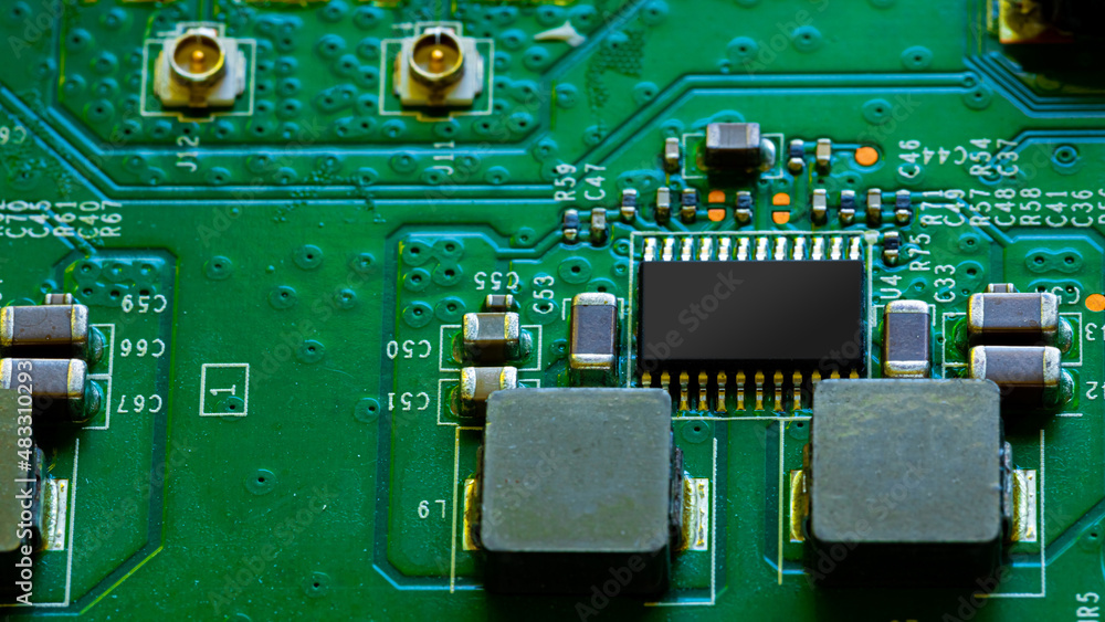 Fototapeta premium Close up of components and microchips on PC circuit board.