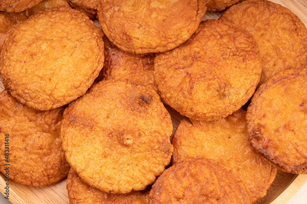 Japanese rice crackers or Senbei, Japan traditional snack, Senbei are often eaten with green tea as a casual snack. Japanese rice crackers or Senbei, Japan traditional snack, Senbei are often eaten with green tea as a casual snack.