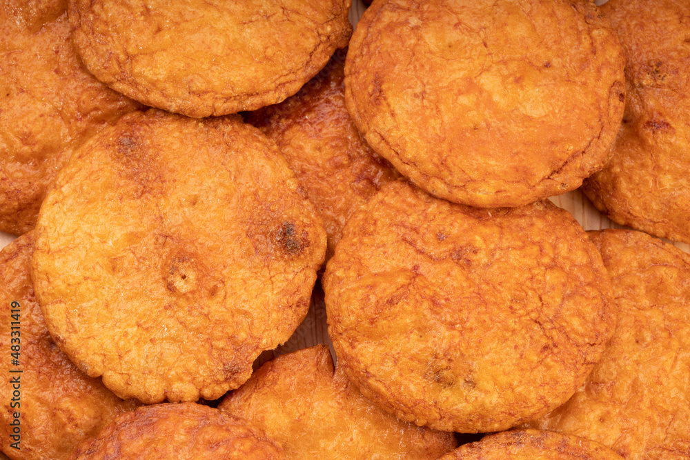 Japanese rice crackers or Senbei, Japan traditional snack, Senbei are often eaten with green tea as a casual snack. Japanese rice crackers or Senbei, Japan traditional snack, Senbei are often eaten with green tea as a casual snack.