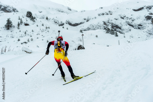 A participant in a biathlon competition during a winter sports event.