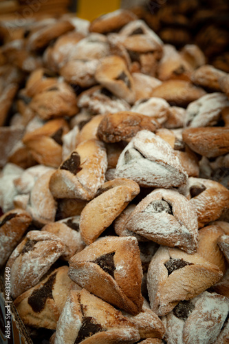 Traditional triangle-shaped cookies baked in celebration of the Jewish holiday of Purim. 