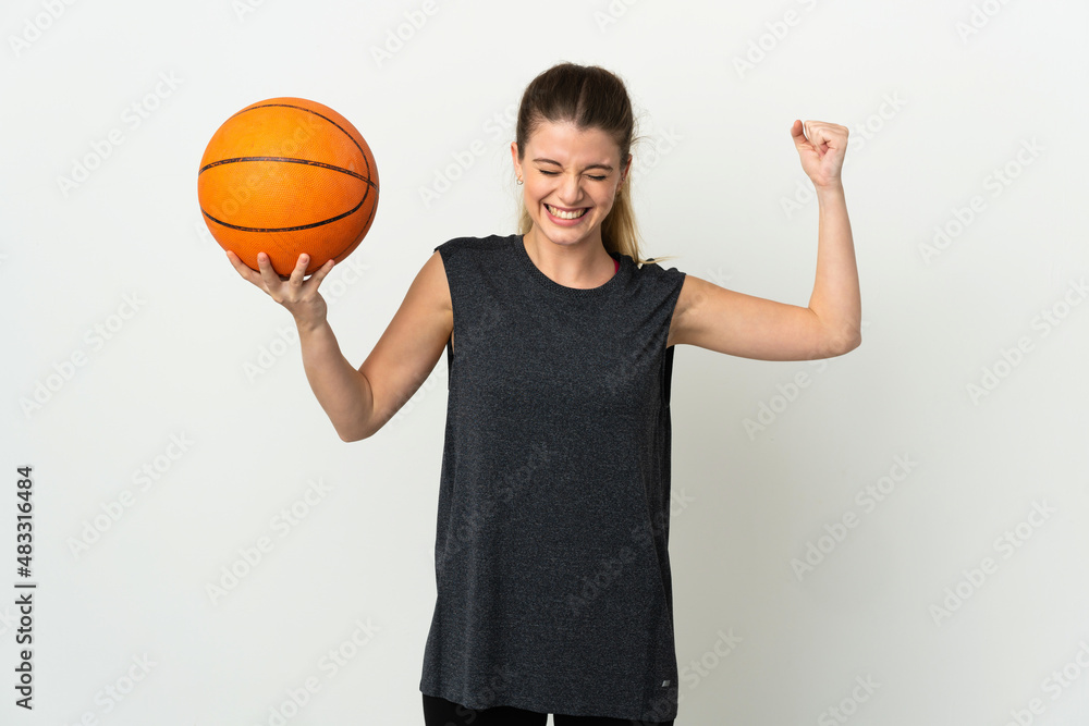 Young blonde woman isolated on white background playing basketball