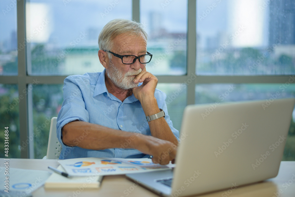Caucasian senior Businessman working in modern office