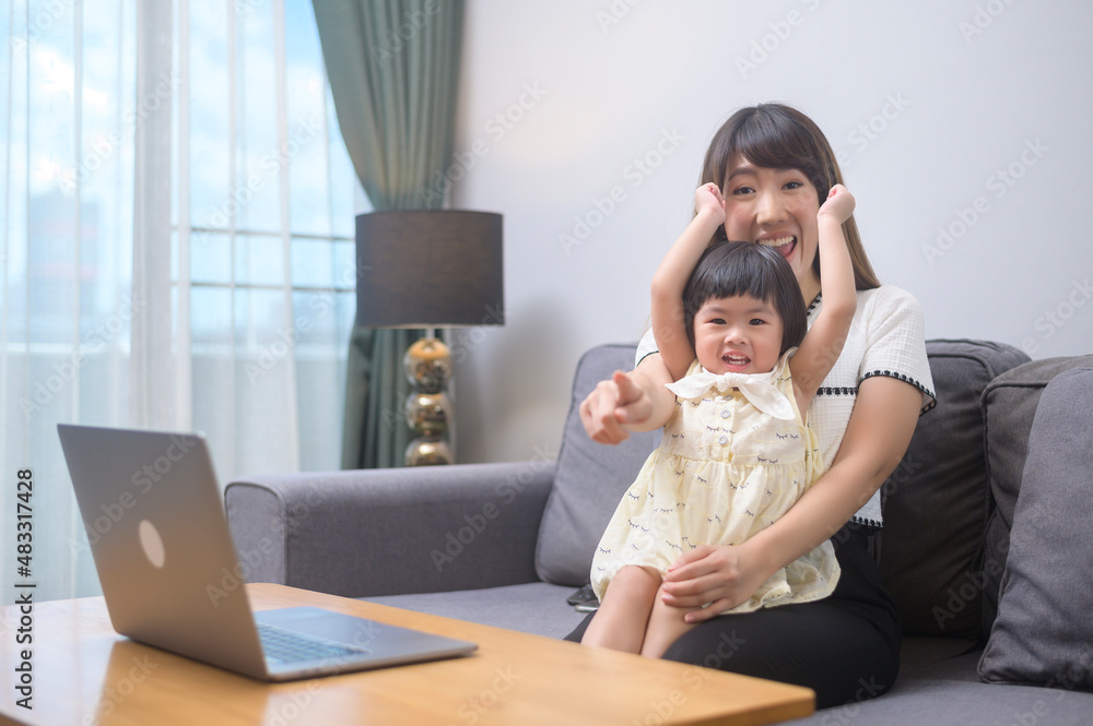 Happy mom and daughter relaxing at home Happy mom and daughter relaxing at home