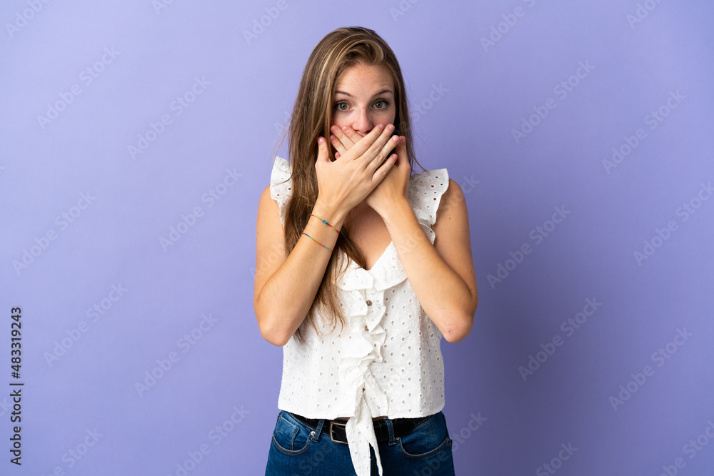 Young caucasian woman over isolated background covering mouth with hands Young caucasian woman over isolated background covering mouth with hands