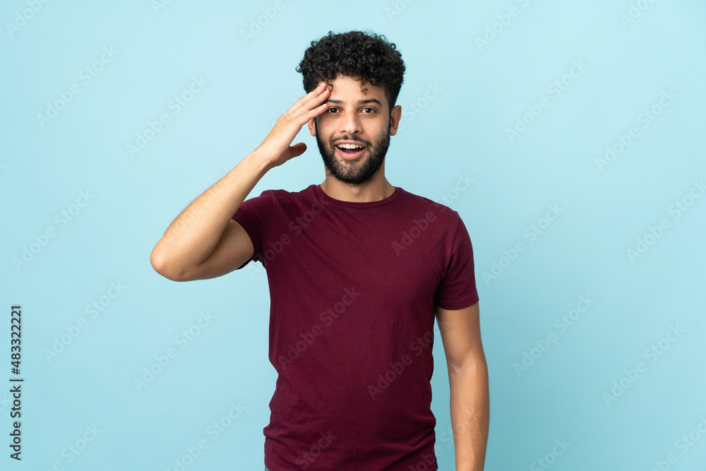Young Moroccan man isolated on blue background has realized something and intending the solution Young Moroccan man isolated on blue background has realized something and intending the solution