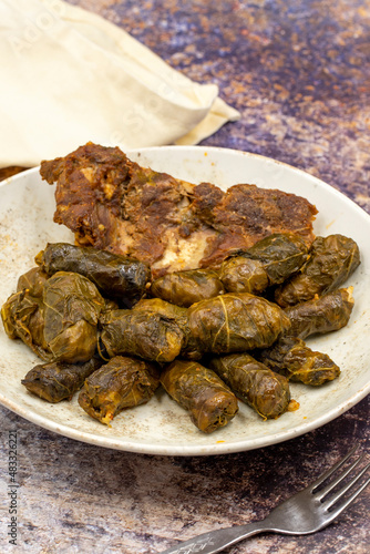 Meat leaf wrapping. Traditional Mediterranean flavor. Wrapping leaves on a dark background. local name etli yaprak sarma