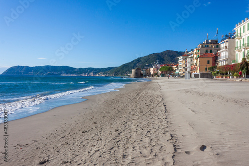 the beach of alassio, in the riviera di ponente coast, in liguria, on a clear November morning photo
