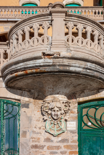details of art nouveau on the facade of an old palace in Liguria