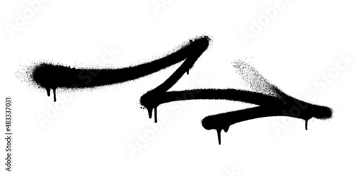 Graffiti arrow with overspray in black over white.