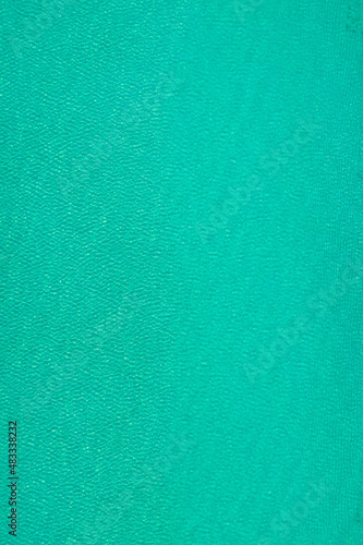 Background, texture of relaxing, calm turquoise, transparent sea water with stones. Summer vacation. Blue ocean lagoon. Drone, copter top view.