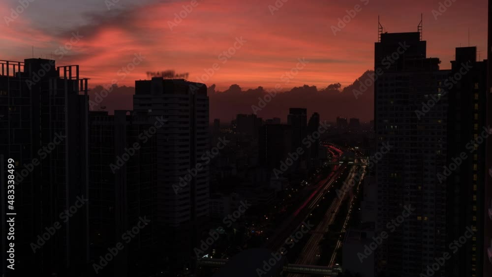 Time lapse shot of cityscape with skyscrapers, buildings and industrial smog under city on the background. Bangkok, Thailand Time lapse shot of cityscape with skyscrapers, buildings and industrial smog under city on the background. Bangkok, Thailand