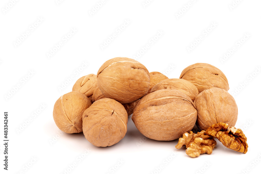 Walnuts in shells isolated on white background. Package design element with clipping path. Walnuts in shells isolated on white background. Package design element with clipping path.