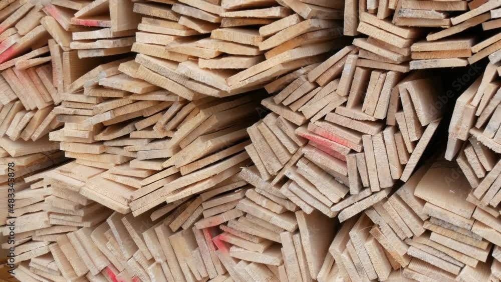 Warehouse of thin wooden boards for construction on the street. Blanks for future construction Warehouse of thin wooden boards for construction on the street. Blanks for future construction