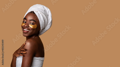 Beautiful african american woman wearing golden under eye patches