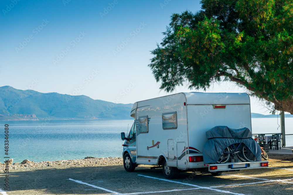 Camper van parked on the beach