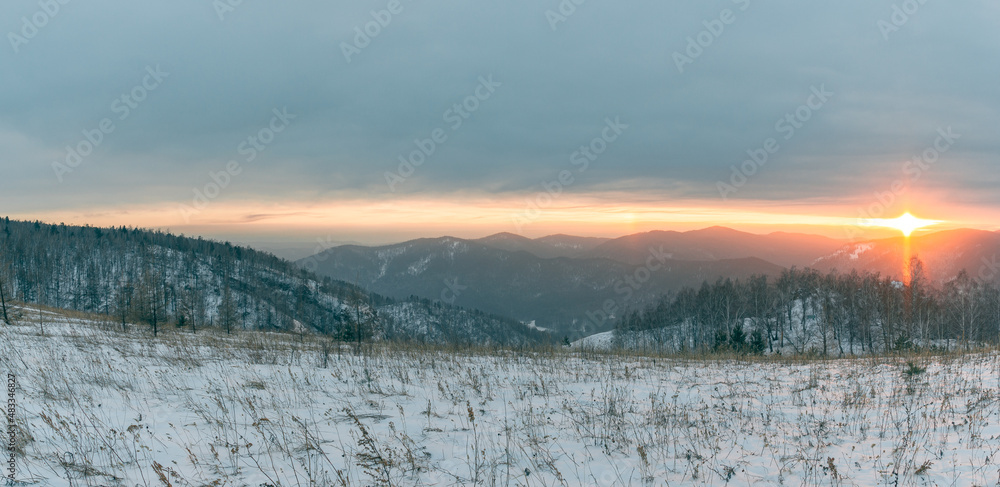 Fabulous panoramic view of the mountain valley at sunset. A ray of sun hitting the ground. Fabulous panoramic view of the mountain valley at sunset. A ray of sun hitting the ground.