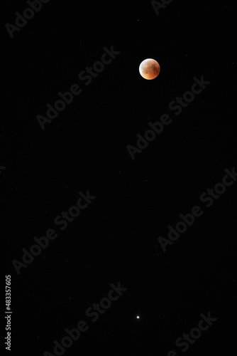 Red bloody moon on black sky as background, full moon and stars. full moon in the night