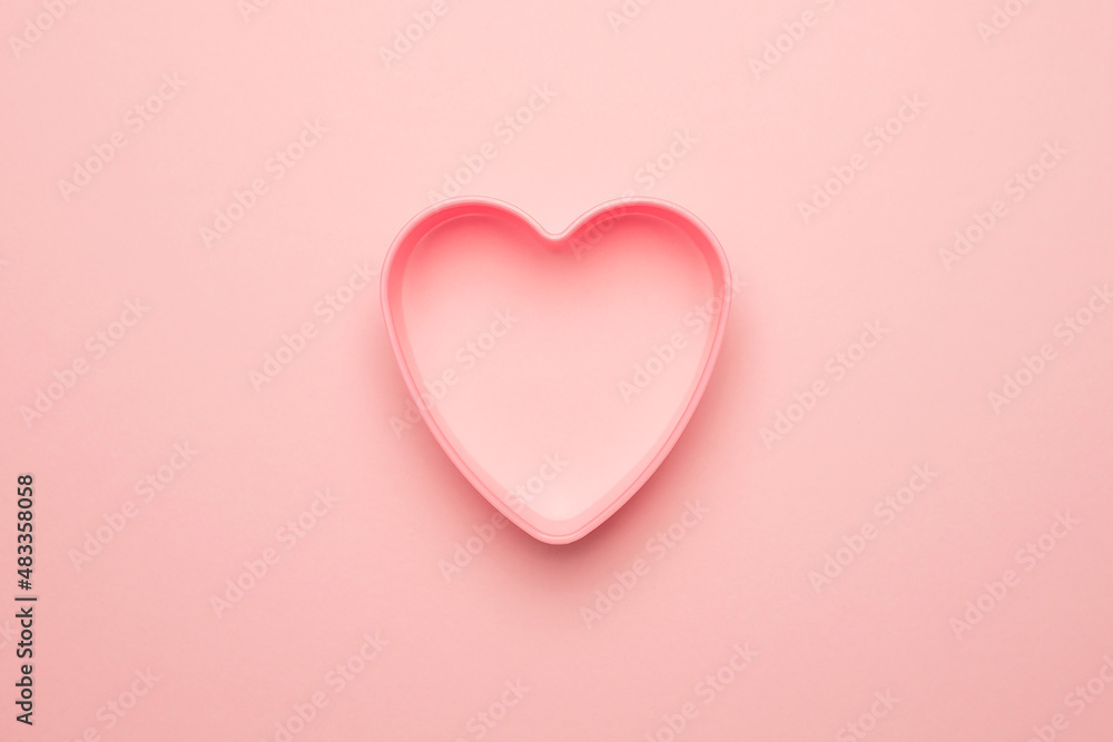 A heart on a pink background. Valentine's Day Concept.