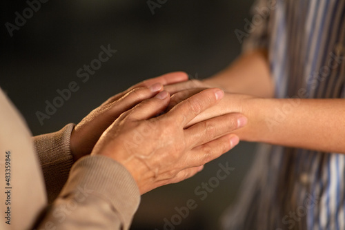 people, family and charity concept - close up of women holding hands © Syda Productions