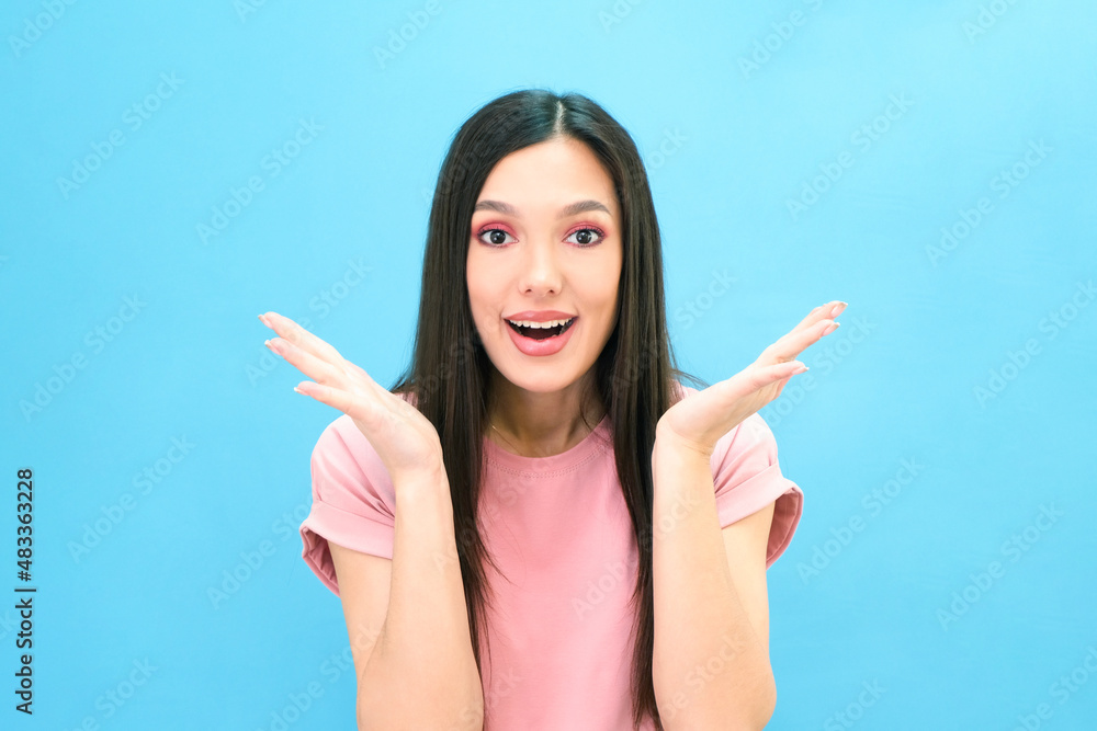Beautiful young brunette woman is surprised. Expression of surprise Beautiful young brunette woman is surprised. Expression of surprise