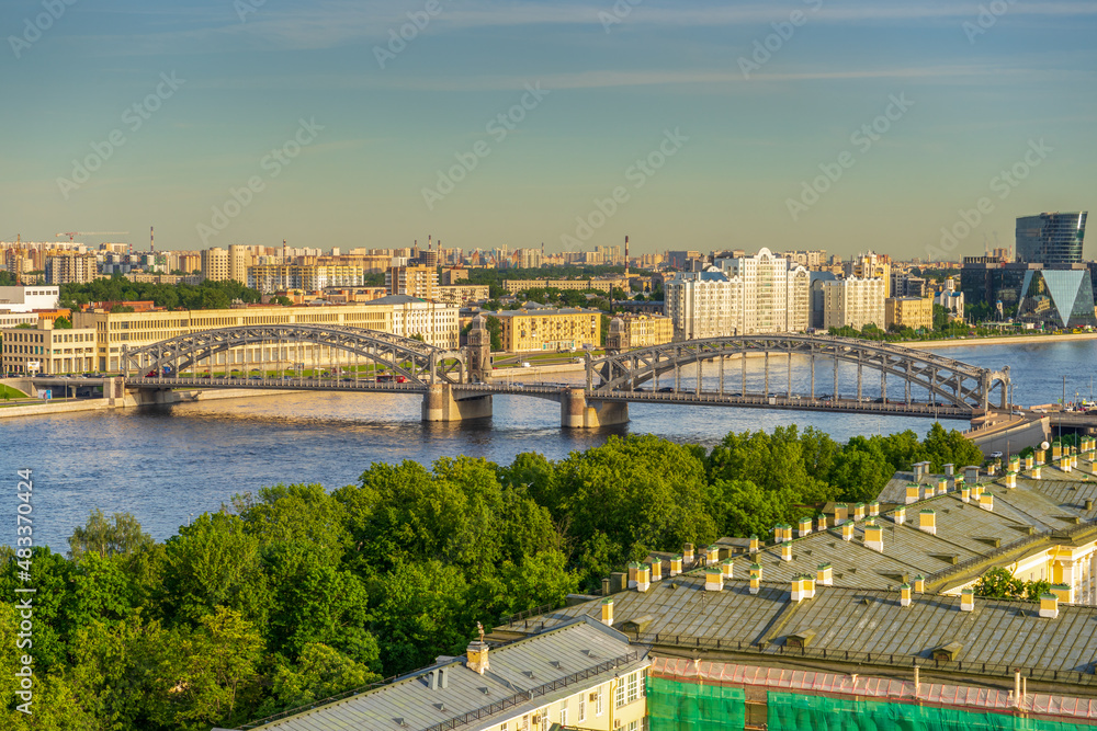 View from bell tower of Smolny Cathedral to historic centre of Saint-Petersburg and Bolsheokhinsky bridge in sunny summer evening. Panoramic cityscape of St. Petersburg, Russia. Travel blog concept