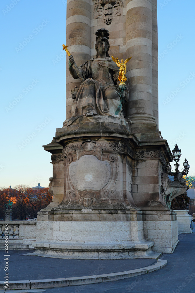 The landmark Pont Alexandre III bridge over the River Seine in Paris, connecting the Invalides area to the Champs-Elysees neighborhood.