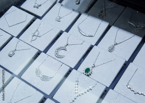Diamond necklaces in a jewelery display. diamond jewelery