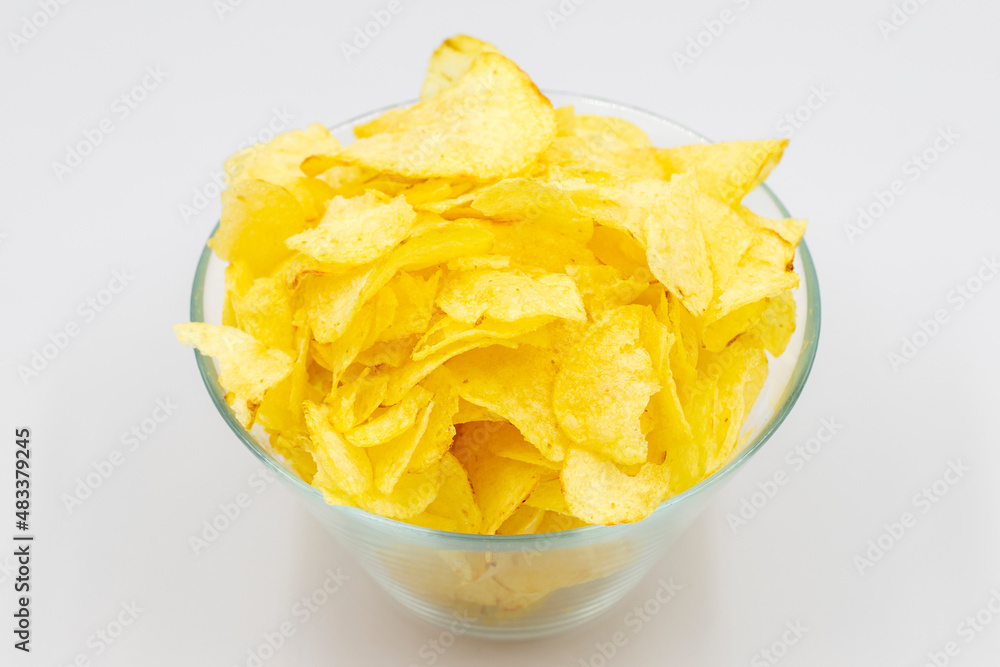 Potato chips or Crispy in a bowl on white background. Close up Potato chips or Crispy in a bowl on white background. Close up