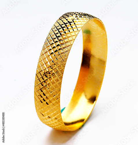 Gold jewelry. Gold bracelet on white background