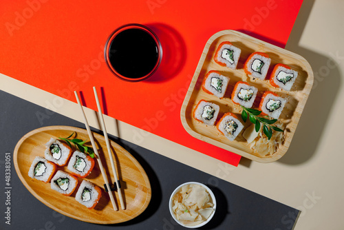 Fish food - sushi, on a bright colored background.
