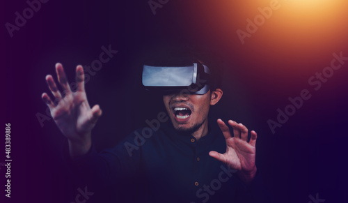 Man using VR glasses playing game metaverse nft project