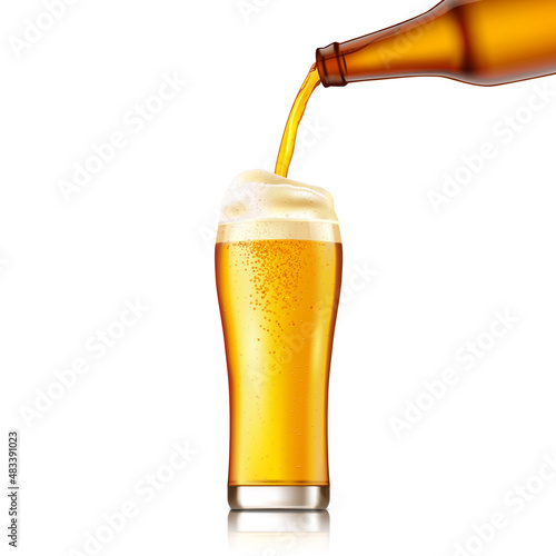 Light lager beer flows from bottle in glass.