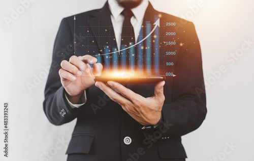 Businessman trading stock market on visual screen digital chart data analysis , Trader photo