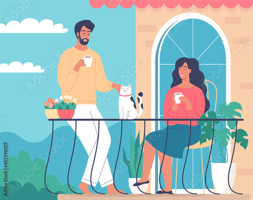 Cute romantic couple drinking morning coffee with their cat on the summer terrace