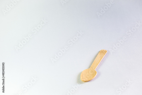 A picture of a wooden spoon in a white background