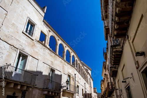 Arched last floor. Empty street low-angle architectural view, Lecce, Brindisi, Italy